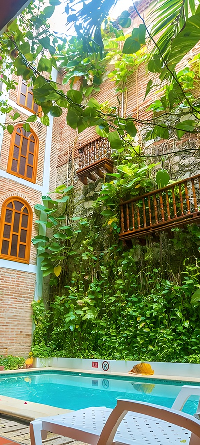 the courtyard and swimming pool of the Hotel Don Pedro De Heredia located in Cartagena, Colombia