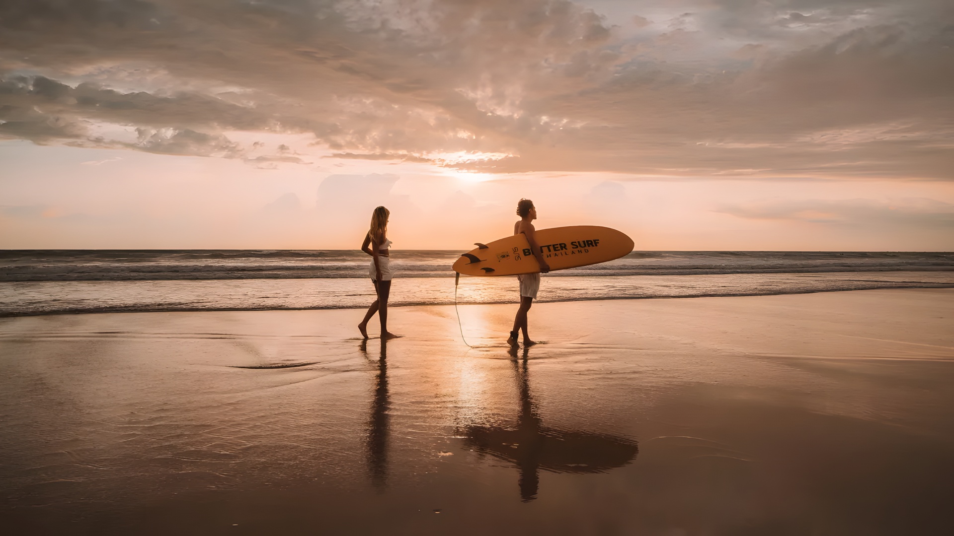 Couple on a beach at sunset