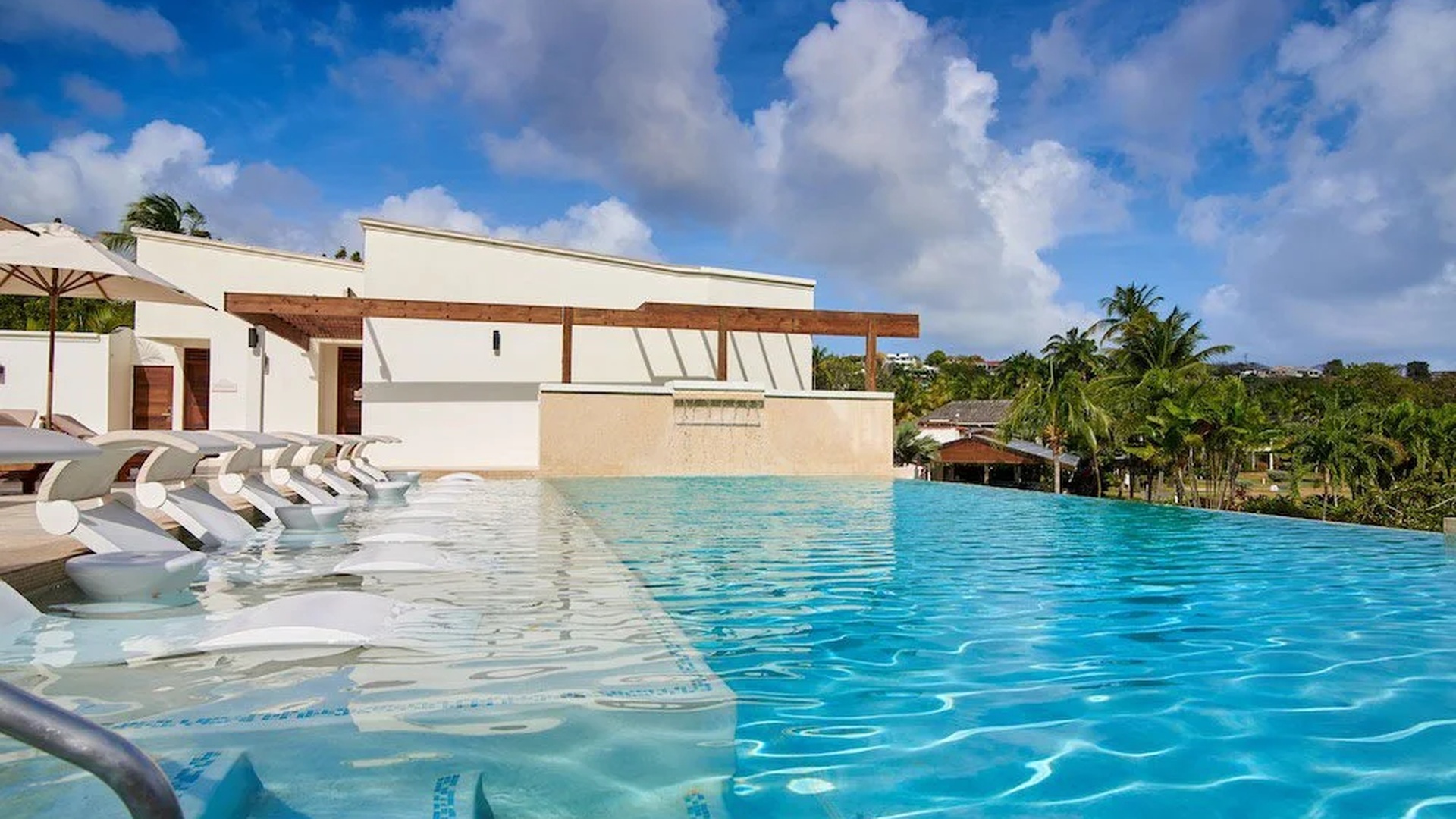 a luxury pool area at the Calabash Hotel in Grenada