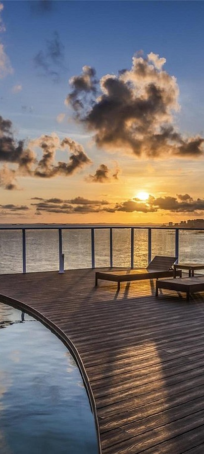 the outdoor swimming pool and deck area at the Novotel Salvador Rio Vermelho hotel in Salvador, Brazil