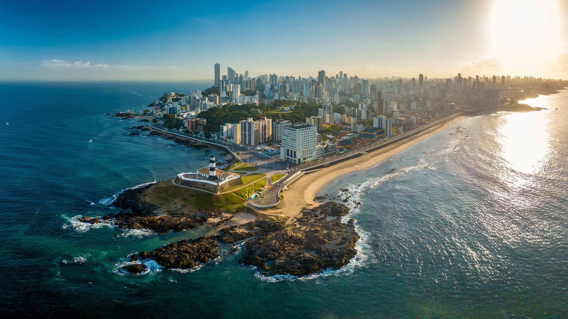 aerial view captures the Farol da Barra lighthouse and beach area in Salvador, Bahia, Brazil