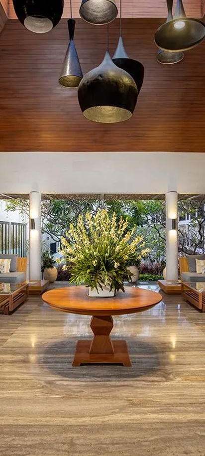 the lobby area of the Away Bali Legian Camakila resort in Bali, Indonesia