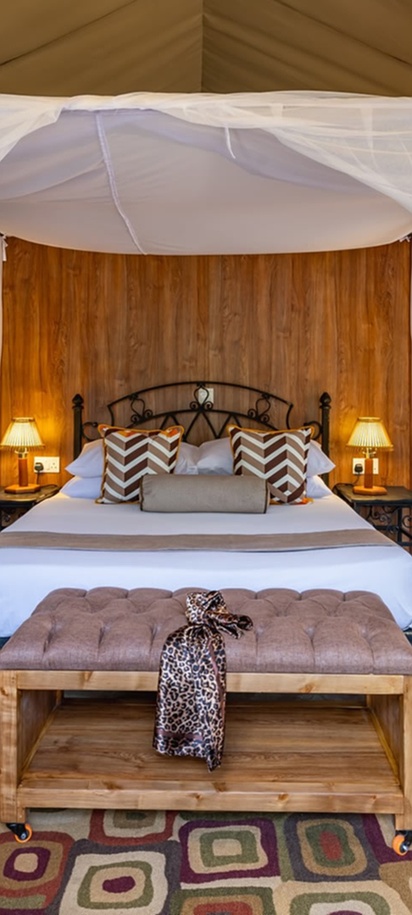 a luxury tented room at the Sentrim Mara Lodge located in the Maasai Mara National Reserve in Kenya