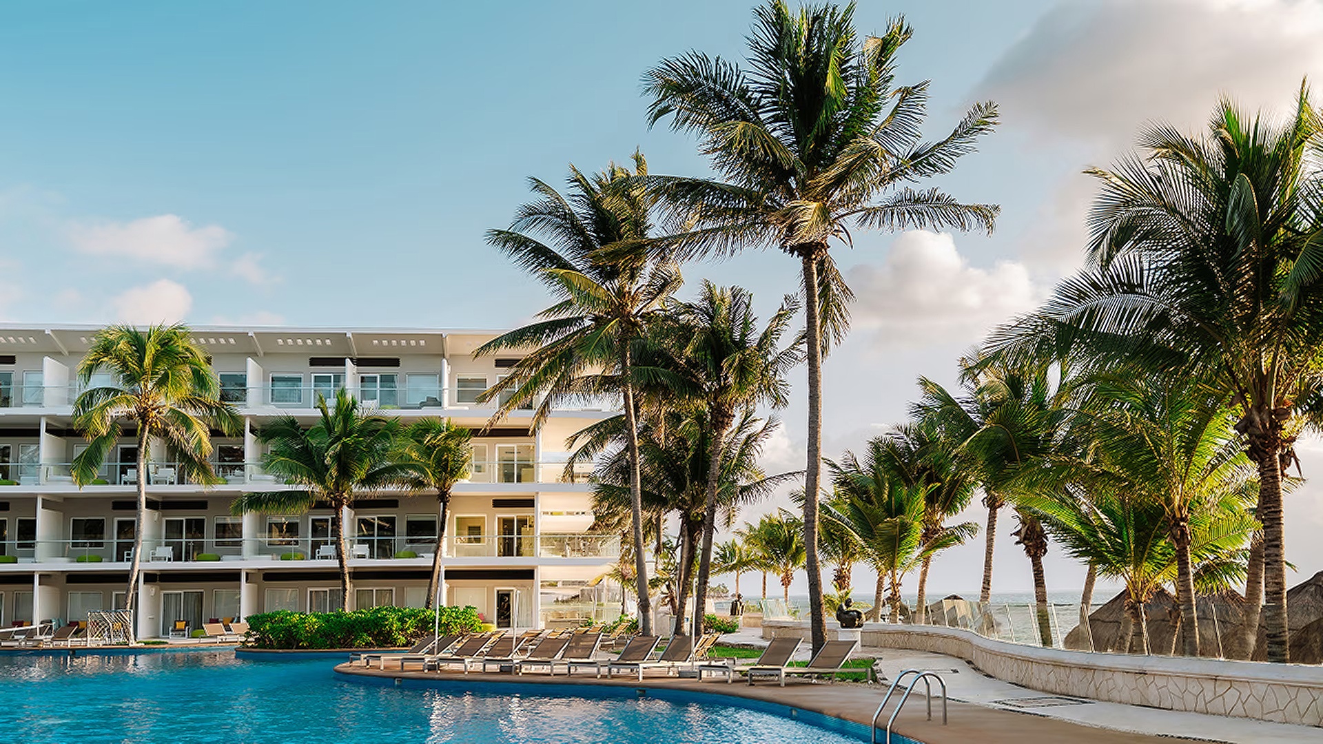 the swimming pool of the Iberostar Selection Riviera Cancún, an all-inclusive luxury resort located in Puerto Morelos, Mexico