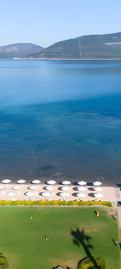 aerial view of the private beach and pier at the Hotel Corte Rosada Affiliated by Meliá in Alghero