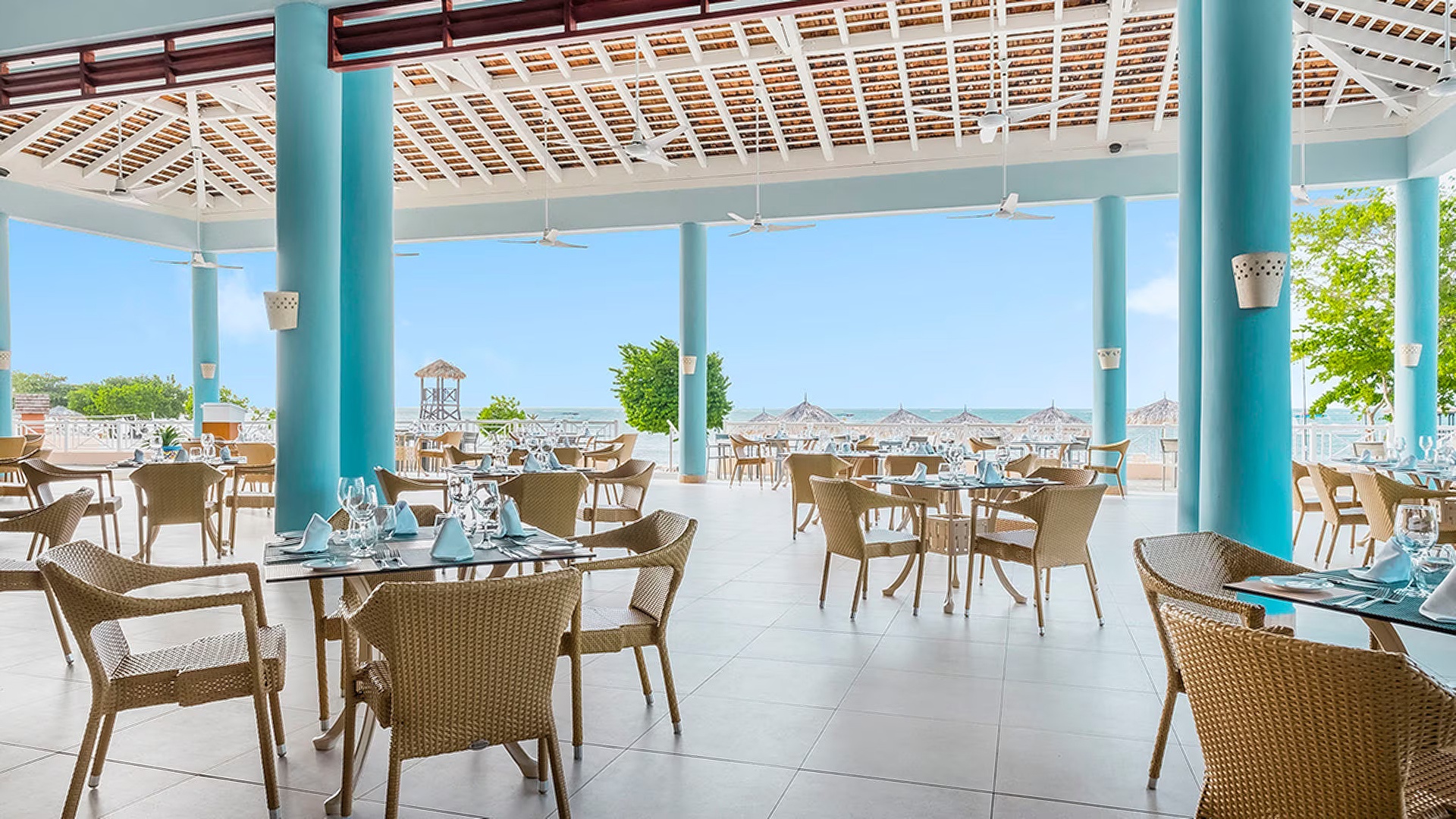 an open-air restaurant area at the Iberostar Waves Rose Hall Beach hotel in Montego Bay, Jamaica