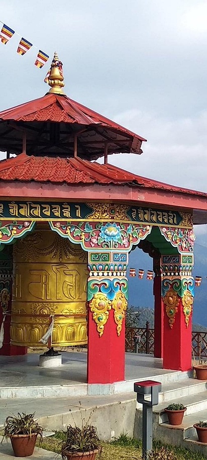 a prayer wheel gazebo at the Pelling Skywalk in West Sikkim, India