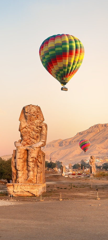 a sunrise hot air balloon ride over the ancient city of Luxor, Egypt