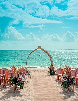 Beach wedding setup at Atelier Playa Mujeres