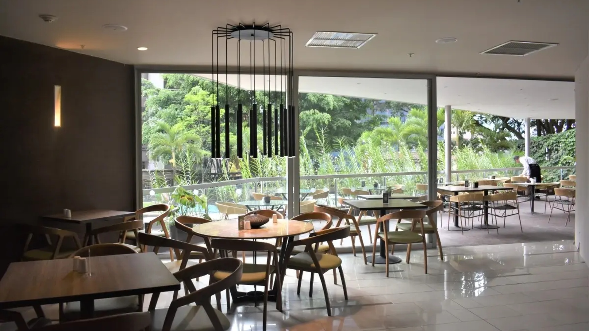 the interior of the Fiola Trattoria restaurant located inside the Hotel Estelar Blue in Medellín, Colombia