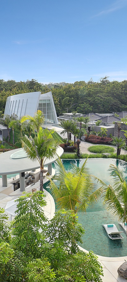 an aerial view of the main central pool area and wave-shaped wedding chapel at Cross Bali Breakers