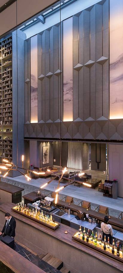 the lobby and bar area of the Novotel Shanghai Clover hotel located in Pudong, Shanghai