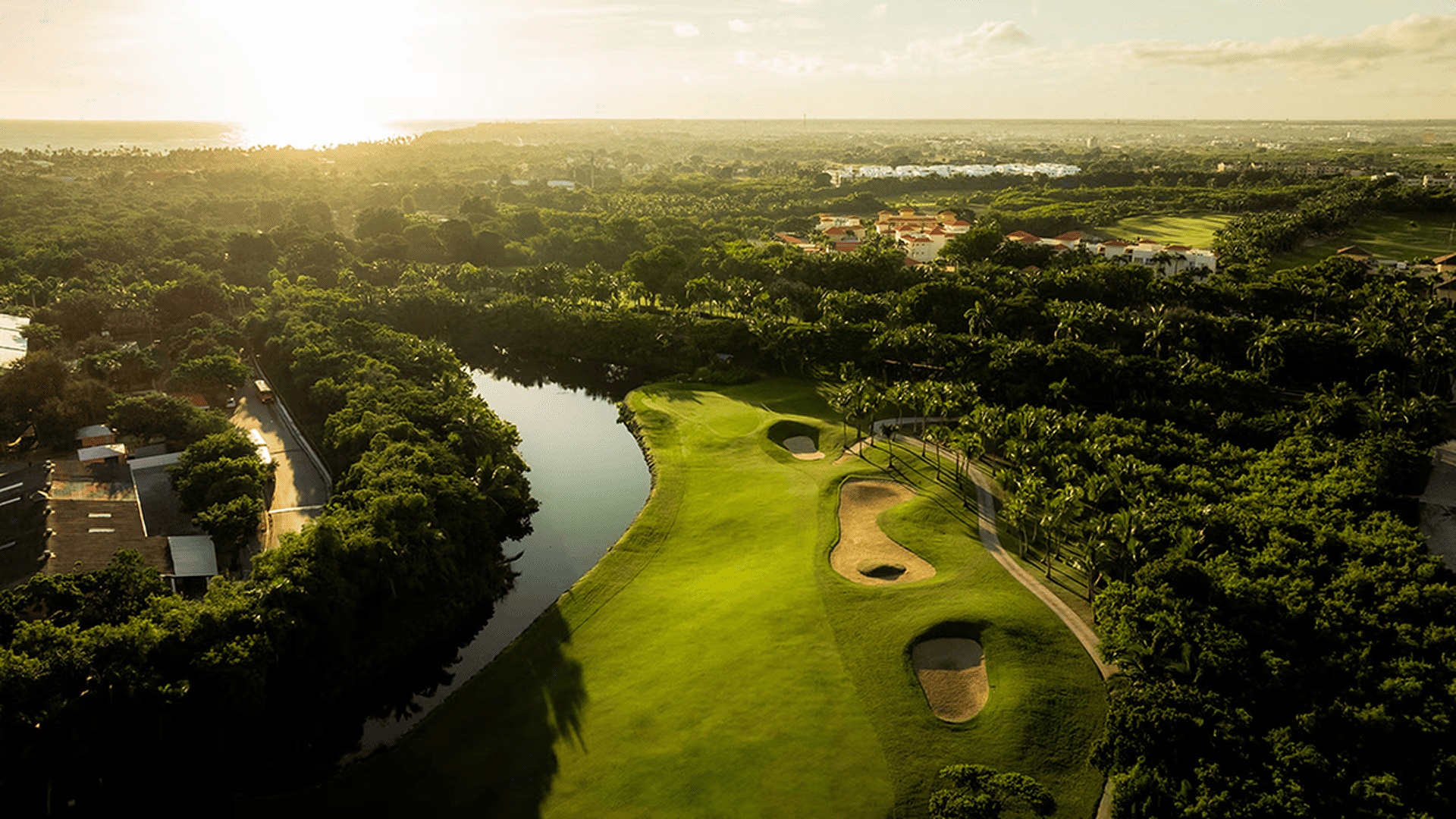 an aerial view of the Sta. Elena Golf Club, an award-winning golf course known for its lush greenery and hardwood trees