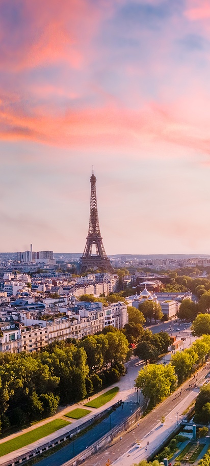 a scenic sunset panorama of Paris, France, featuring the iconic Eiffel Tower and the Seine River