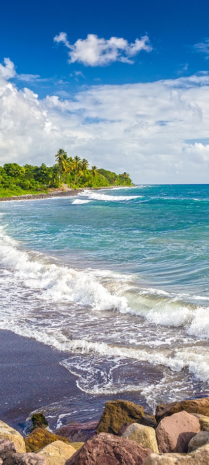 a scenic view of a beach on the island of St. Kitts