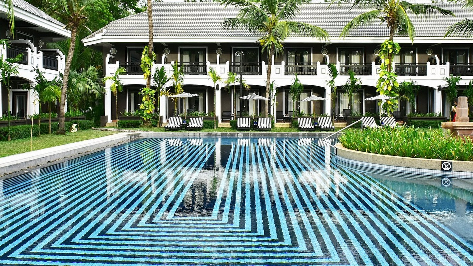 swimming pool area of the Shinta Mani Shack hotel in Siem Reap, Cambodia