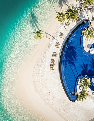 aerial view of Conrad Maldives Rangali Island resort pool