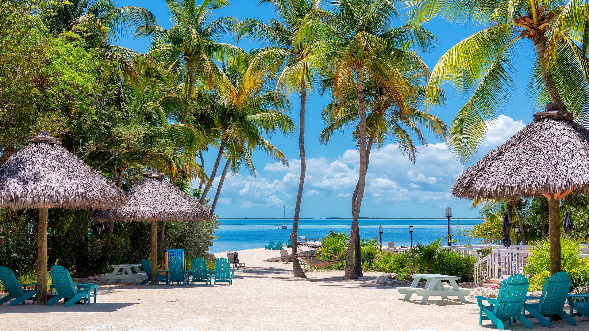 Relaxing beach scene with thatched parasols