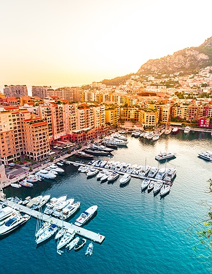 fleet of Formula 1 cars navigating the legendary Fairmont Hairpin (formerly known as the Loews Hairpin) during the Monaco Grand Prix