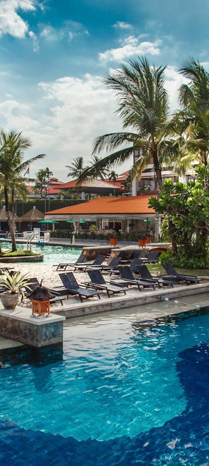outdoor swimming pool and sand island area at the Hard Rock Hotel Bali