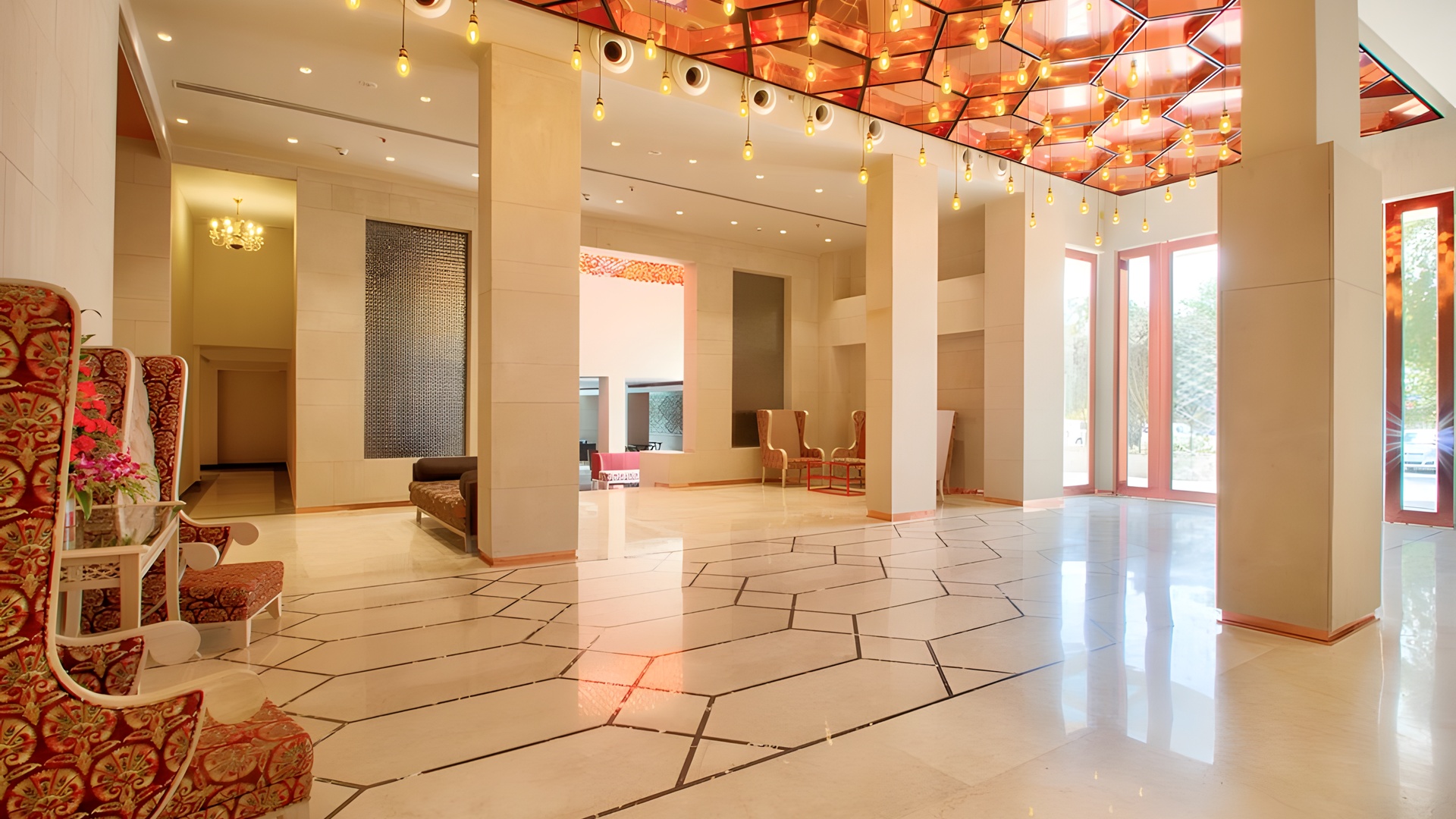 the lobby of the Sarovar Premiere Jaipur, a luxurious 5-star hotel located in the city of Jaipur, India