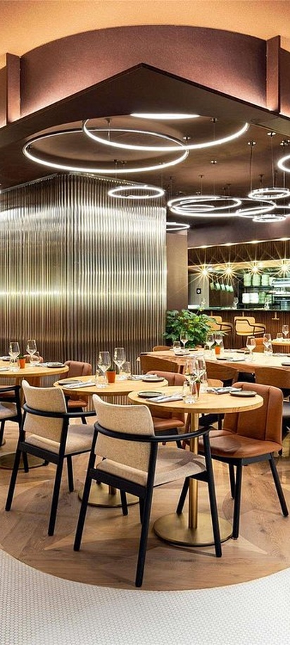 the interior of the FI'LIA restaurant located within the Pullman Paris Montparnasse Hotel in Paris.