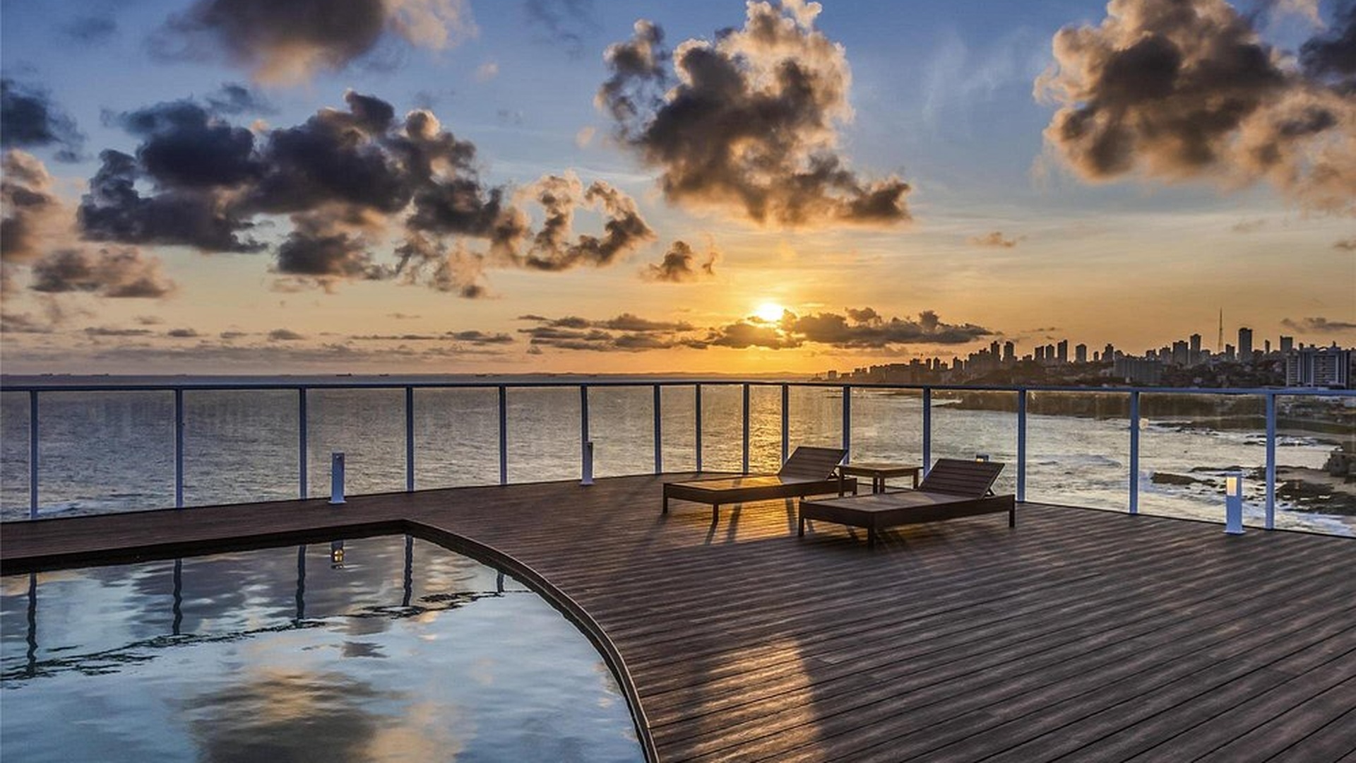 the outdoor swimming pool and deck area at the Novotel Salvador Rio Vermelho hotel in Salvador, Brazil