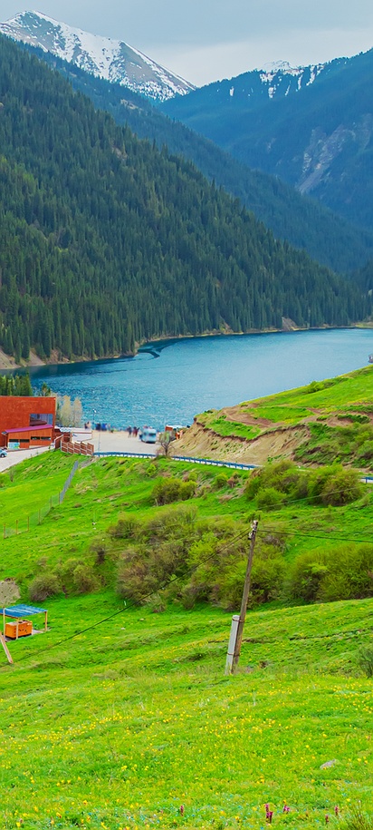 a scenic viewpoint overlooking Kolsai Lake in Kazakhstan