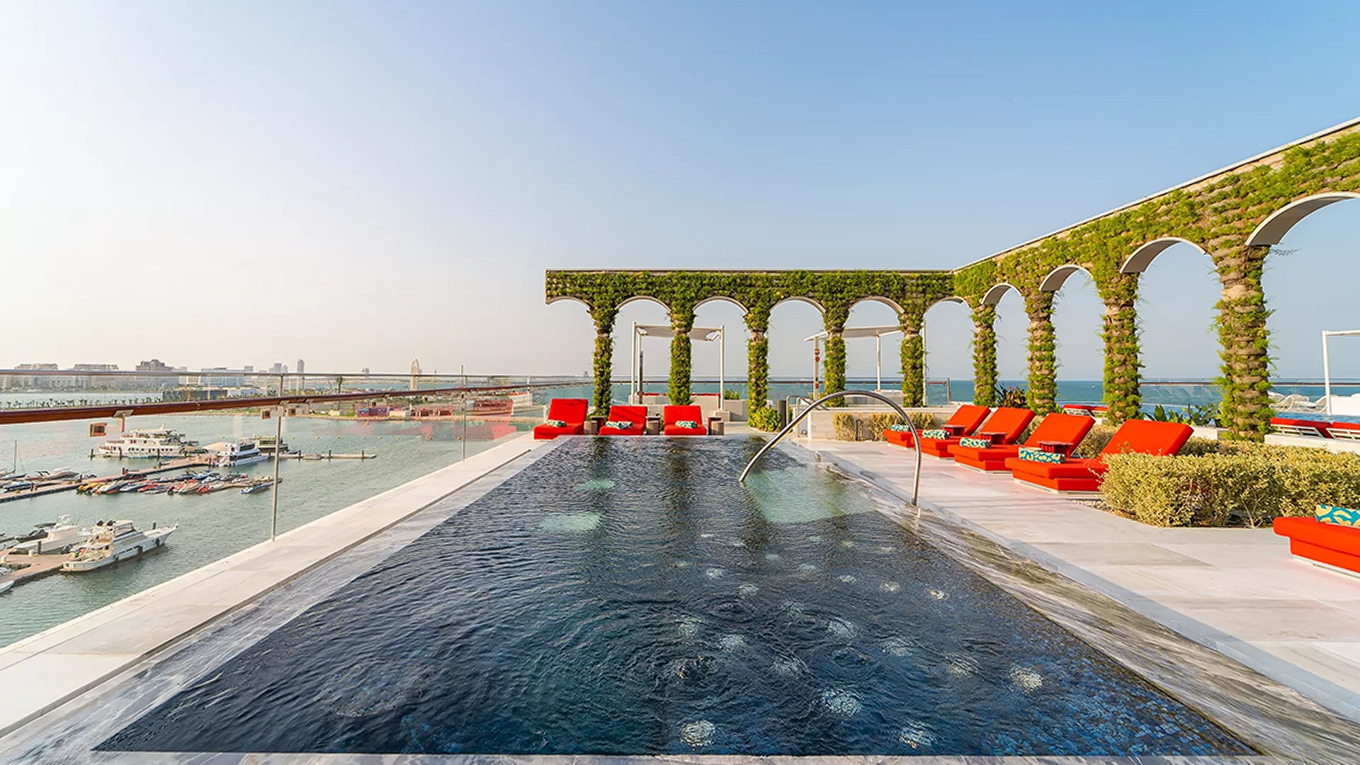 Aqua Urban Deck, a luxurious rooftop bar and pool area located at the Raffles Doha hotel in Qatar. 