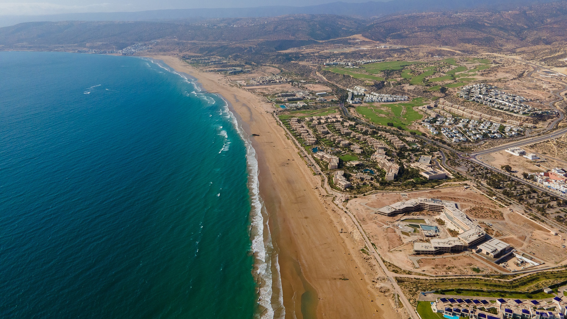 an aerial view of Taghazout Bay in Agadir, Morocco