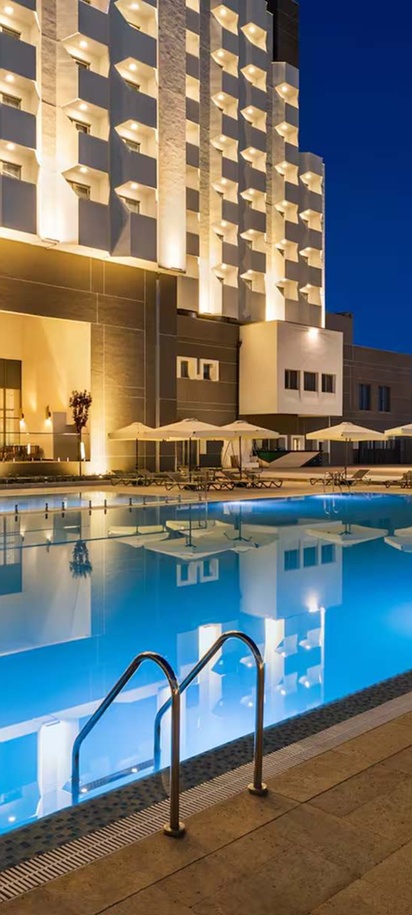 the outdoor pool area of the Wyndham Bukhara hotel in Uzbekistan