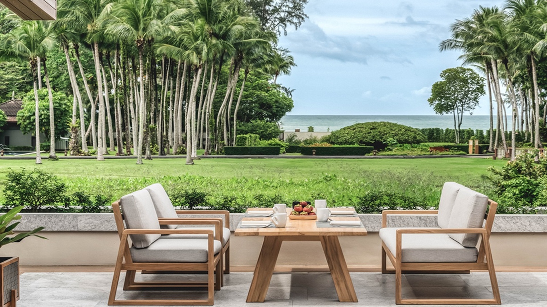 This outdoor dining set is located at the Dusit Thani Krabi Beach Resort in Krabi, Thailand. 