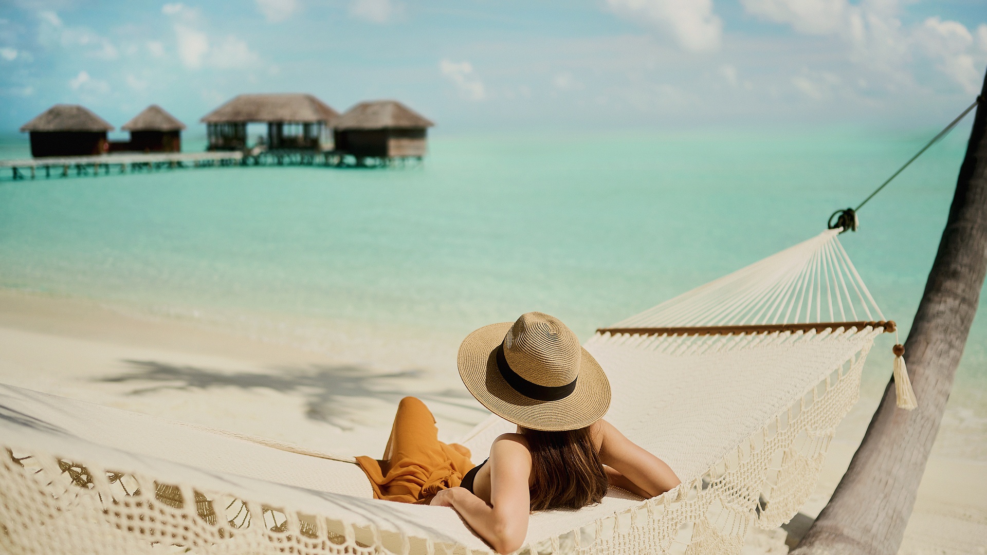 relaxing at beach Conrad Maldives Rangali Island resort