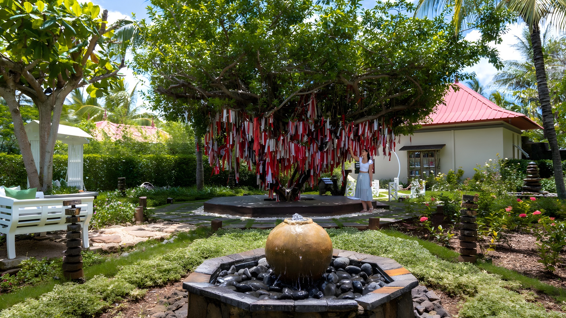 the lush garden area and a popular "wishing tree" at the Tamassa Bel Ombre Resort in Mauritius