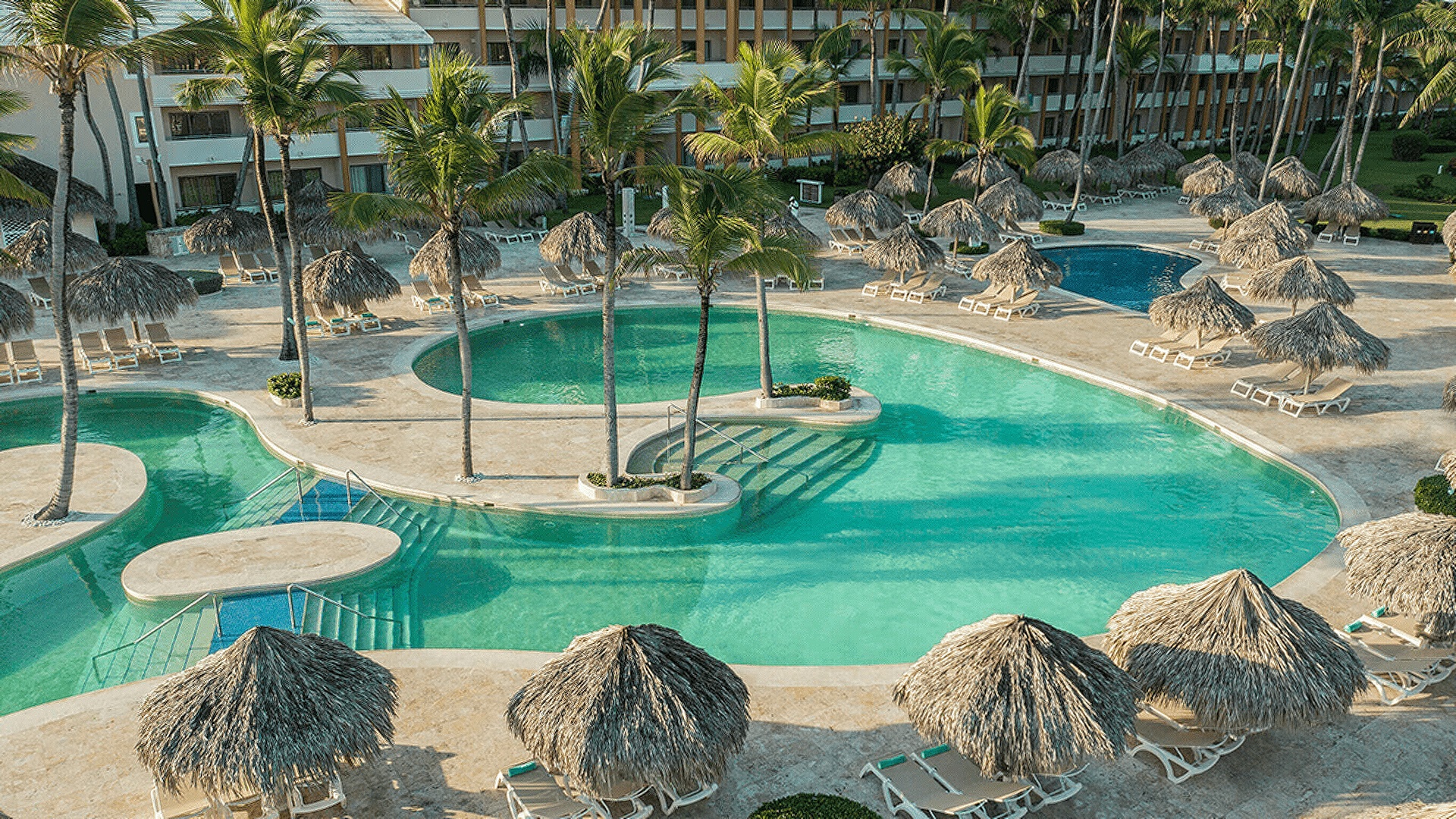 the pool area of the Iberostar Waves Punta Cana or Iberostar Waves Dominicana all-inclusive resort located on Playa Bávaro in the Dominican Republic