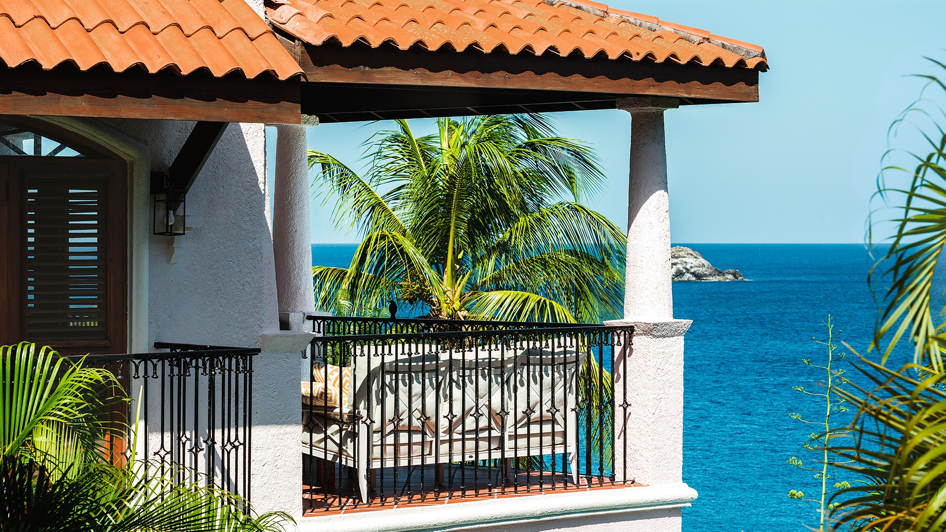 a private balcony with stunning Caribbean Sea views at the Cap Maison Resort & Spa in Saint Lucia.