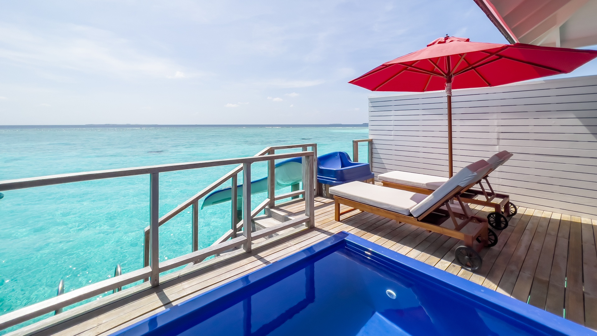 water villa with pool slide with ocean view