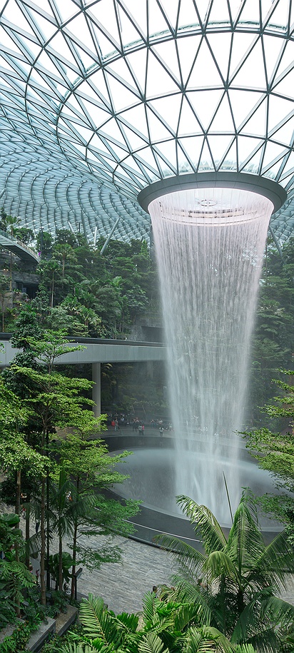 the Jewel Changi Airport in Singapore, specifically featuring the HSBC Rain Vortex, which is the world's tallest indoor waterfall