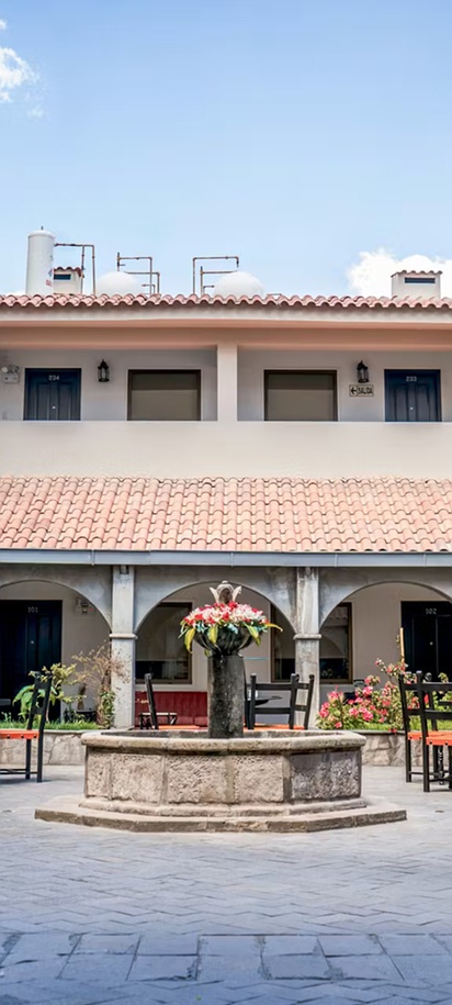 the central courtyard of the Hotel Jose Antonio Cusco, a 4-star hotel located in Cusco, Peru