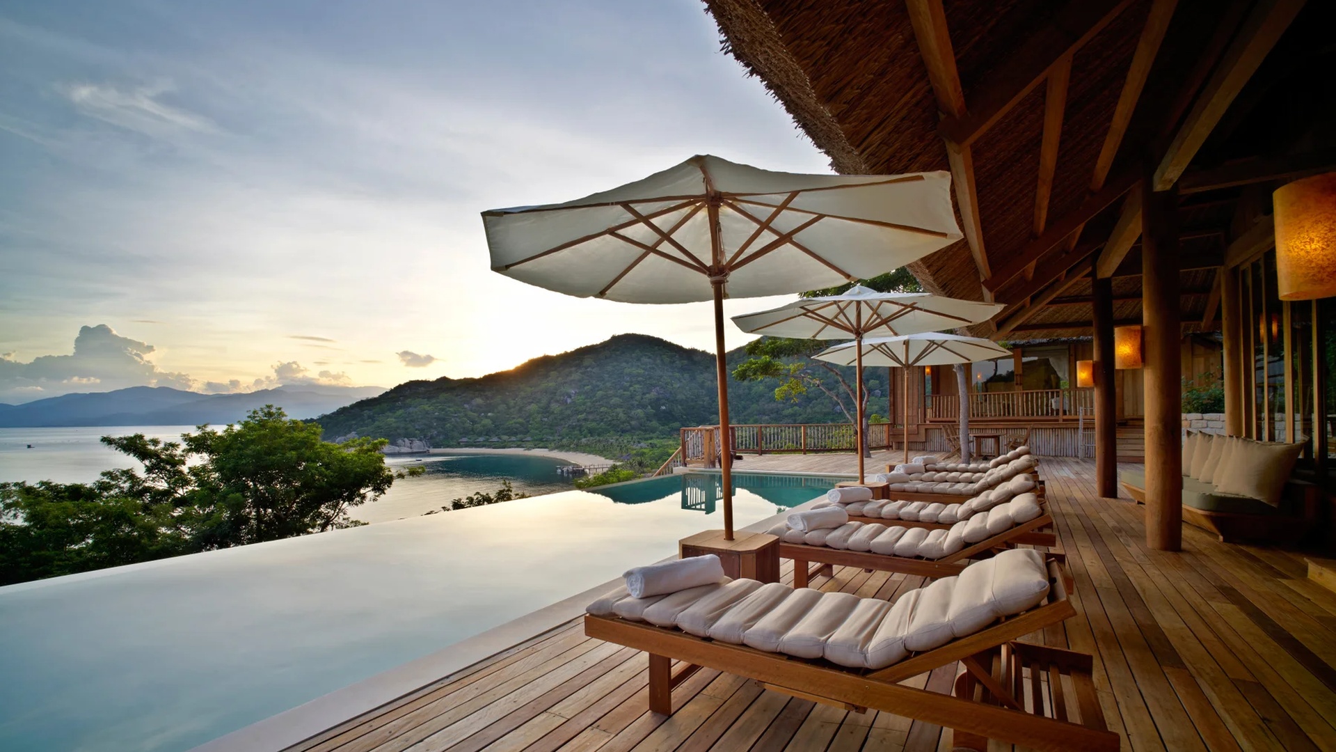 an infinity pool and lounge area at the Six Senses Ninh Van Bay resort in Vietnam