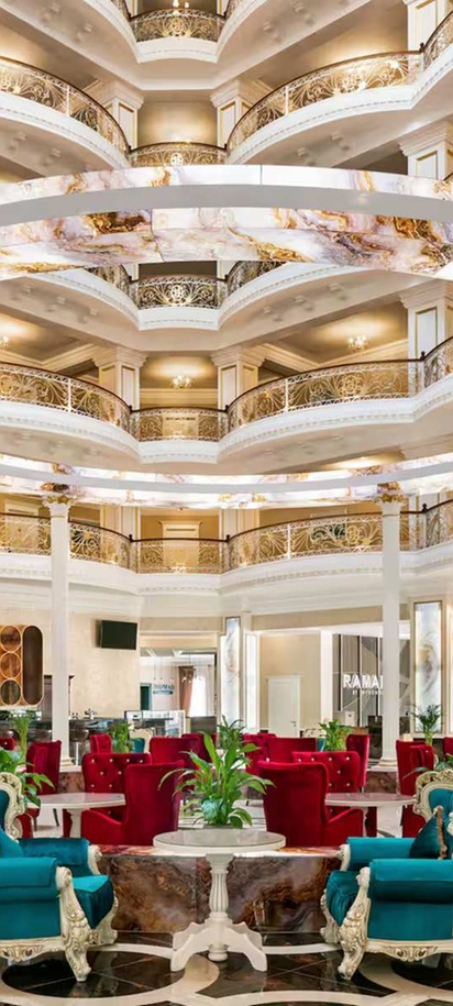 the lobby of the Ramada by Wyndham Shymkent hotel in Kazakhstan