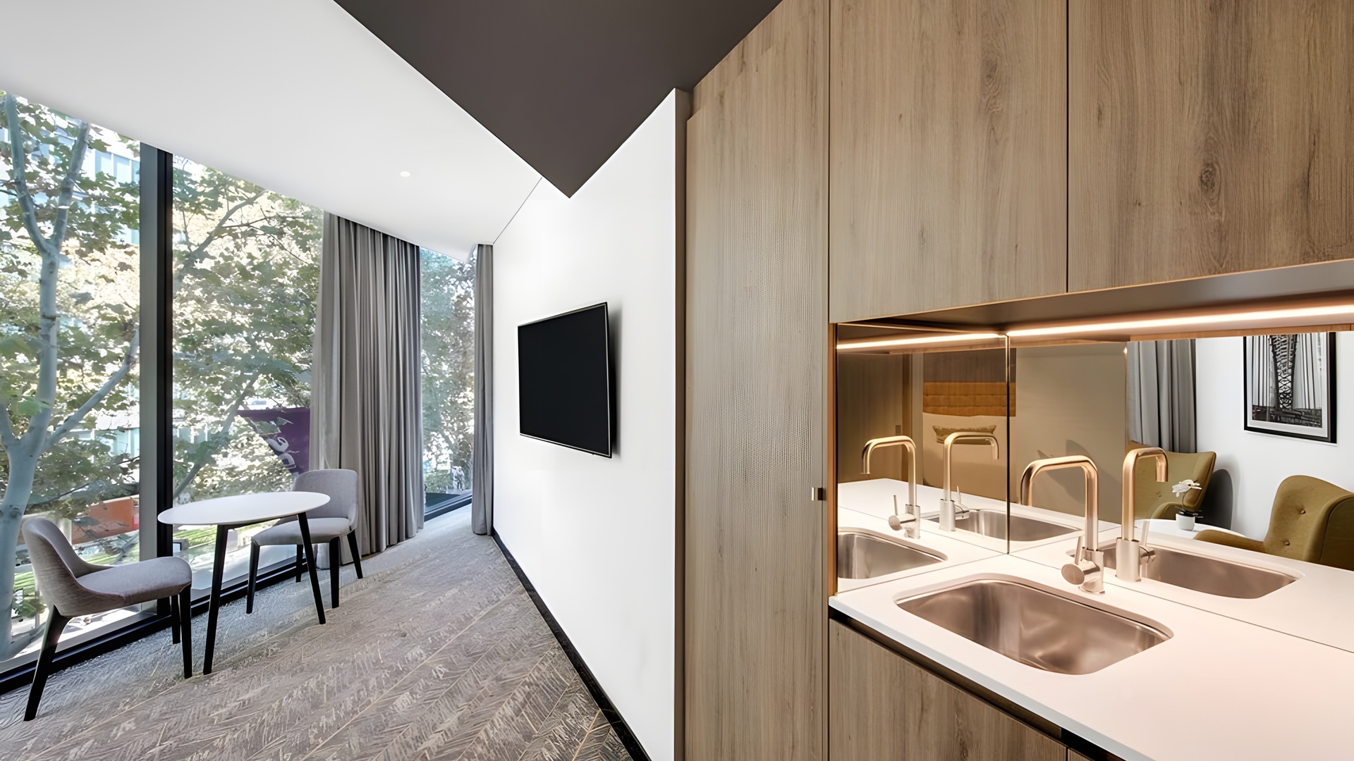 a modern, furnished room at the Vibe Hotel North Sydney