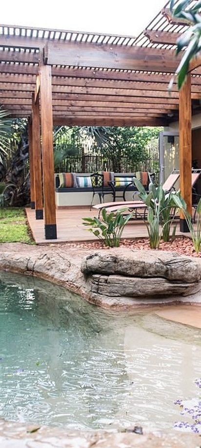 outdoor pool area at the Ghost Mountain Inn, a 4-star country hotel situated in Mkuze, KwaZulu-Natal, South Africa