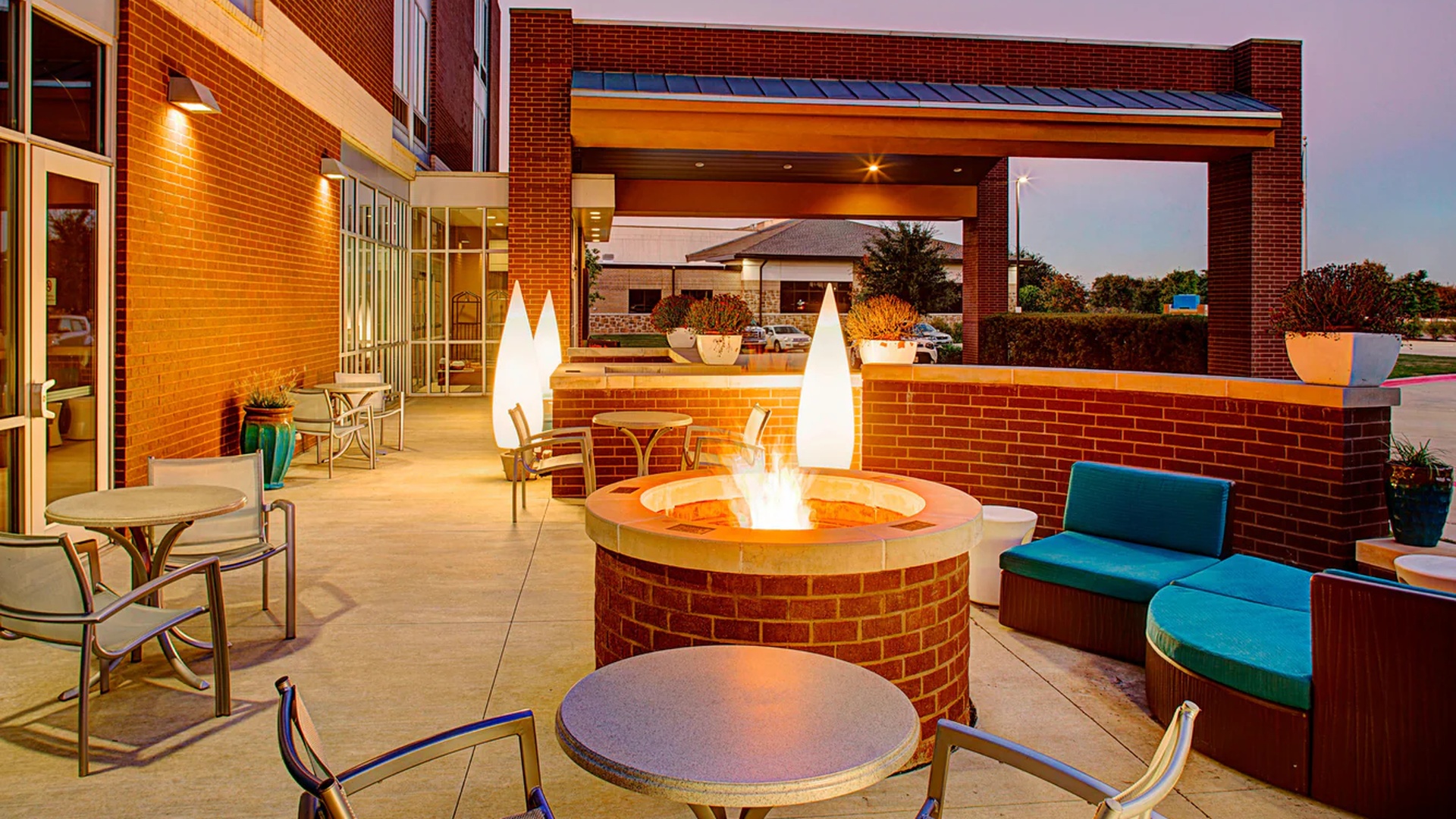 outdoor patio area with a fire pit at the SpringHill Suites by Marriott Dallas Richardson/Plano
