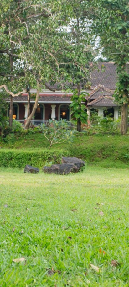 the lush garden and grounds of the Mansao Curtorim heritage villa in South Goa, India