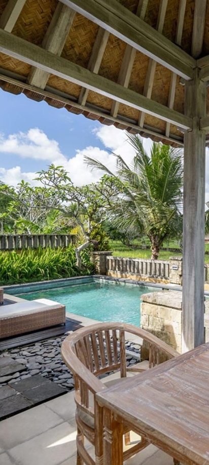 a private villa pool deck overlooking rice paddies, likely at the Wapa di Ume Resort & Spa in Ubud, Bali