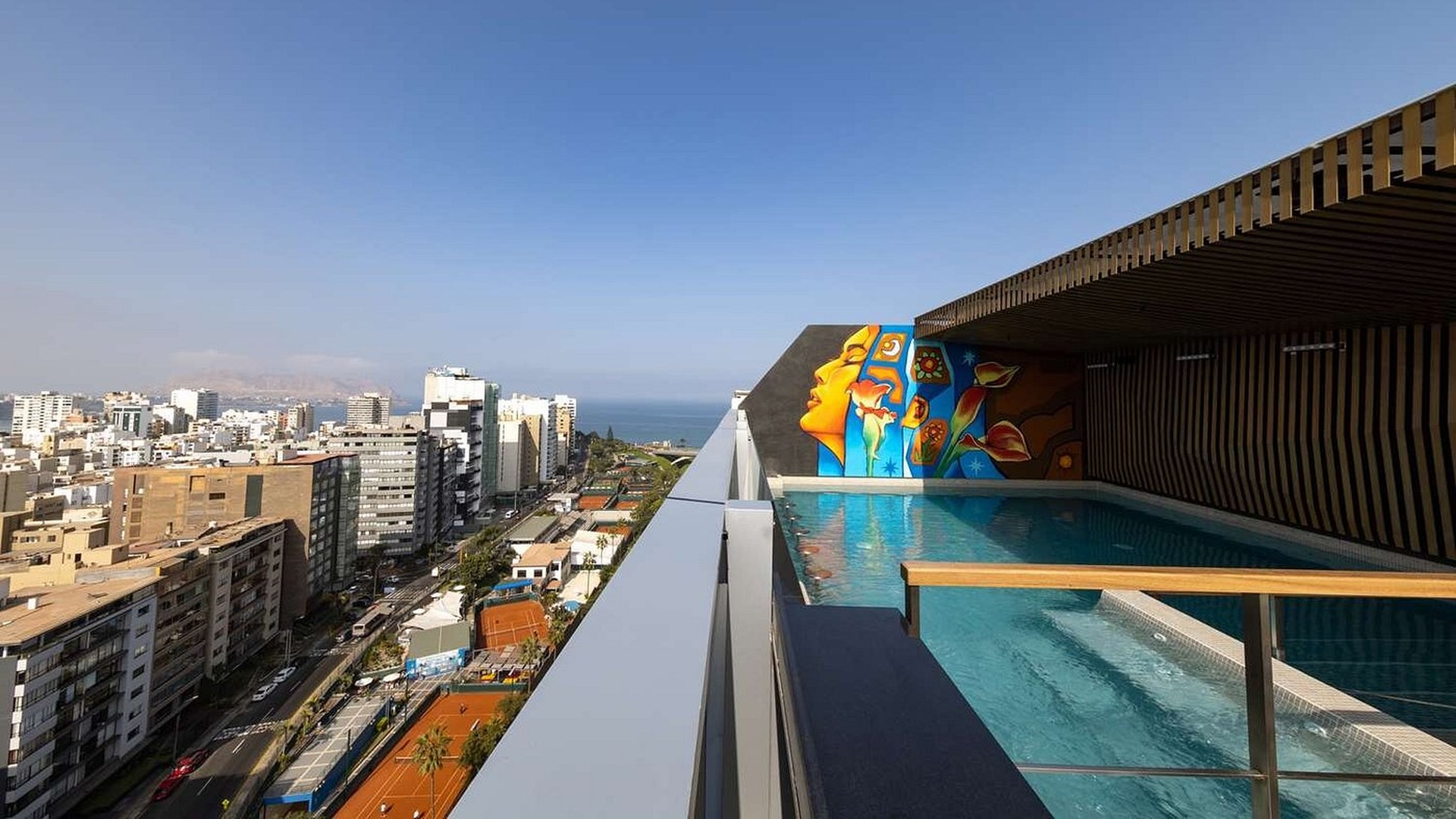 the rooftop pool and terrace area of the Hilton Garden Inn Lima Miraflores hotel, located in Lima, Peru