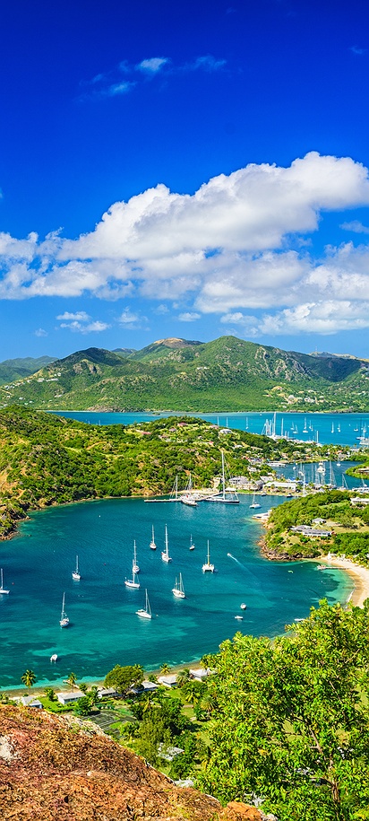 a panoramic view of English Harbour and Falmouth Harbour in Antigua, likely taken from the historic viewpoint at Shirley Heights