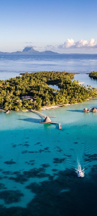 Tropical island resort surrounded by blue water