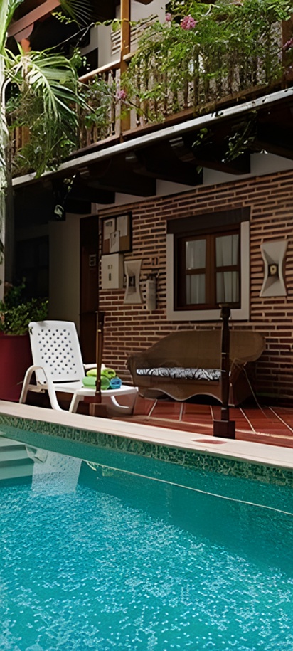 the courtyard and swimming pool area of a hotel or similar residential building